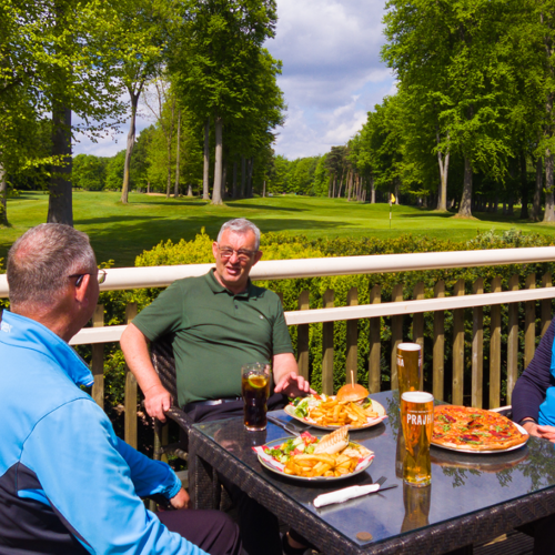 <p>GOLFERS ENJOYING THE PINES BAR</p>